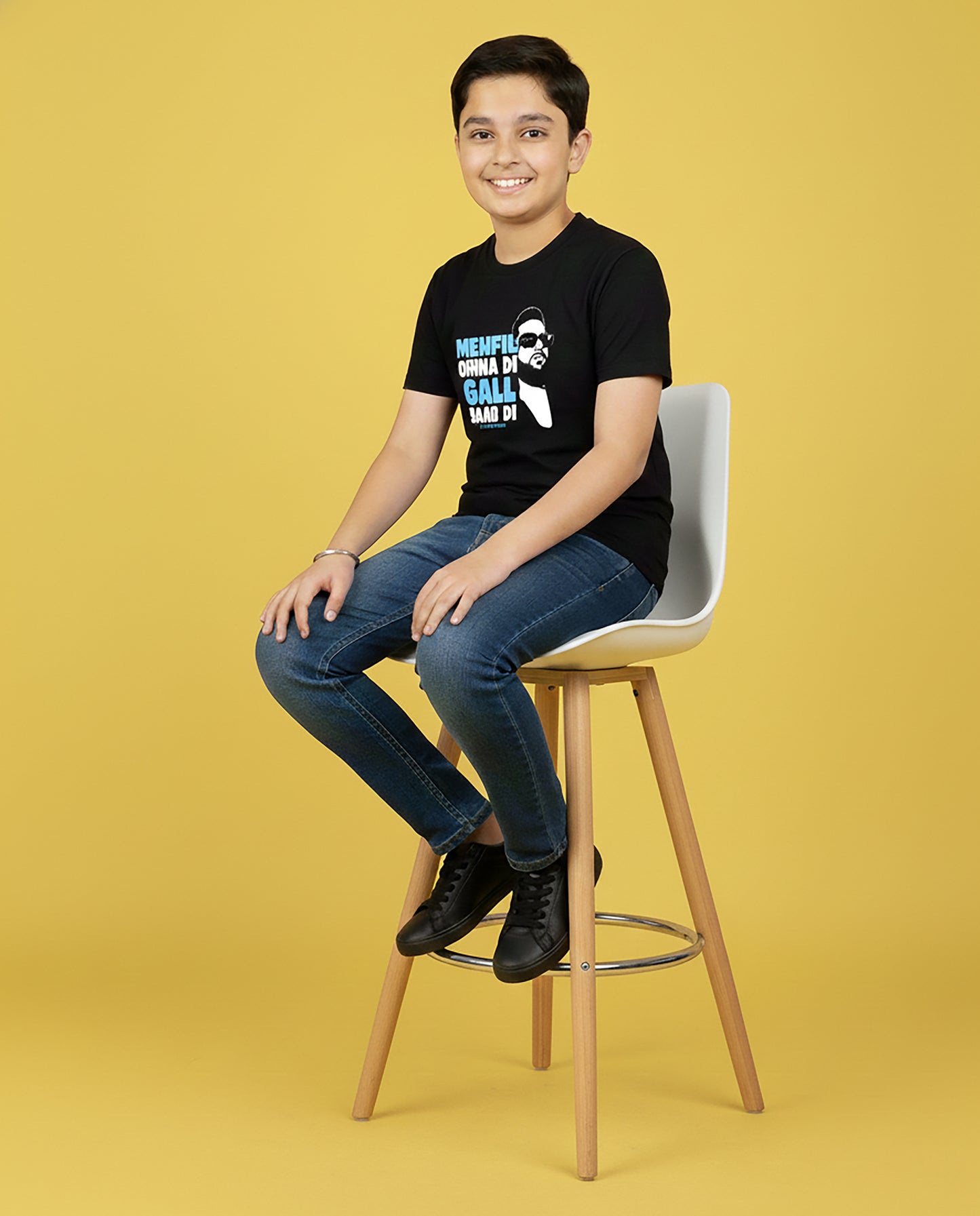 Kid wearing black 7.7 Magnitude Karan Aujla T-Shirt – Unisex Kids Graphic Tee by Garrari