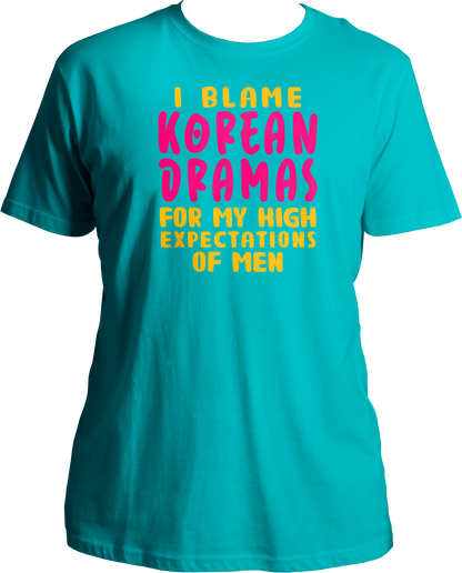 A trendy unisex t-shirt featuring the phrase "I Blame Korean Dramas For My High Expectations Of Men" printed on the front, perfect for female K-Drama fans.