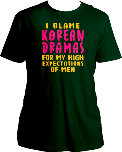 A trendy unisex t-shirt featuring the phrase "I Blame Korean Dramas For My High Expectations Of Men" printed on the front, perfect for female K-Drama fans.