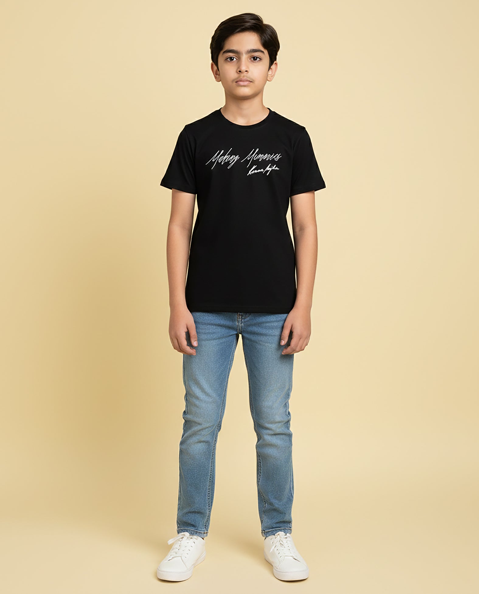 Kid wearing black “Making Memories” Karan Aujla kids unisex T-shirt with signature-style print