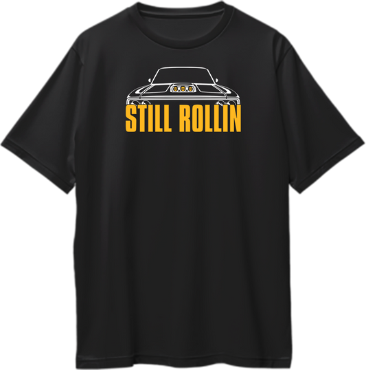 Black Still Rollin Oversized T-Shirt with white muscle car graphic and orange typography